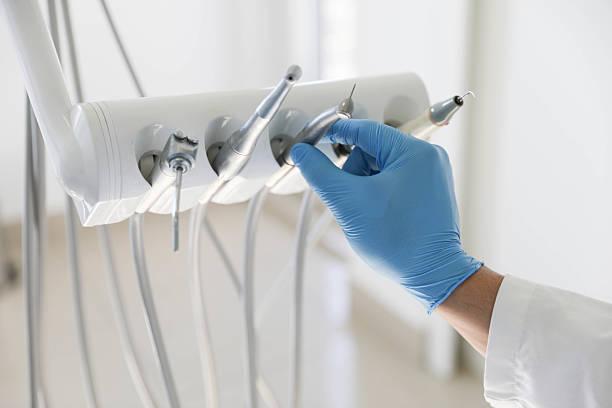 Professional Tooth Extraction technician working in Delhi Hills, OH